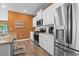 Well-equipped kitchen featuring stainless steel appliances, white cabinets, and island seating at 3021 Sistine St., Myrtle Beach, SC 29579