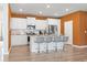 Open kitchen with island seating, white cabinetry, and stainless steel appliances at 3021 Sistine St., Myrtle Beach, SC 29579