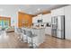Bright kitchen featuring an island with bar seating, white cabinets and stainless appliances at 3021 Sistine St., Myrtle Beach, SC 29579