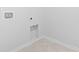 Unfinished laundry room with water hookups, white trim and neutral tile flooring at 3021 Sistine St., Myrtle Beach, SC 29579