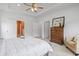 Bright main bedroom featuring a wooden dresser, ceiling fan, and ample closet space at 3021 Sistine St., Myrtle Beach, SC 29579