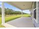 Covered patio overlooking a well-maintained lawn and a row of mature trees at 3021 Sistine St., Myrtle Beach, SC 29579