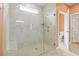 Large walk-in shower featuring neutral tiling, a built-in seat, and a glass enclosure at 3021 Sistine St., Myrtle Beach, SC 29579