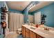 Functional bathroom featuring a double sink vanity, bright lighting, and a shower with curtain at 3120 Mercer Dr., Conway, SC 29526