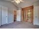 Spacious bedroom with vaulted ceilings, closet doors, and wood grain sliding glass doors at 3120 Mercer Dr., Conway, SC 29526