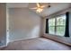 Bright bedroom featuring a ceiling fan, a large window, and neutral-colored walls at 3120 Mercer Dr., Conway, SC 29526