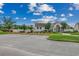 Exterior of a well-maintained white clubhouse, enhanced with landscaping and a manicured lawn at 3120 Mercer Dr., Conway, SC 29526