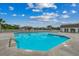 Exterior of a bright community pool with ample space and a charming clubhouse in the background at 3120 Mercer Dr., Conway, SC 29526