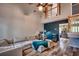 Bright living room with vaulted ceilings, a ceiling fan, wood flooring, a comfortable sectional, and a workspace at 3120 Mercer Dr., Conway, SC 29526