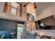 Bright living room featuring a staircase, vaulted ceilings, dark accent wall, stylish decor, and an open layout at 3120 Mercer Dr., Conway, SC 29526