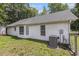 Exterior view of the home showing the backyard with fencing and trees at 3429 Mishoe St., Loris, SC 29569
