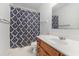 Cozy bathroom features a vanity sink, shower with curtain and neutral finishes at 3429 Mishoe St., Loris, SC 29569