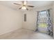 Relaxing bedroom with neutral carpet, ceiling fan, and ample natural light at 3429 Mishoe St., Loris, SC 29569