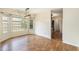 Bright dining room with multiple windows and modern light fixture at 3429 Mishoe St., Loris, SC 29569