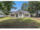 Charming single-story home featuring a well-manicured lawn and classic architectural details, creating a welcoming curb appeal at 3429 Mishoe St., Loris, SC 29569