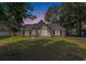 Charming single-story home featuring a well-manicured lawn and classic architectural details, creating a welcoming curb appeal at 3429 Mishoe St., Loris, SC 29569
