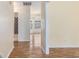 Hallway with a view to multiple rooms and wood-look flooring at 3429 Mishoe St., Loris, SC 29569