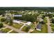 Aerial view of a home with a detached garage, surrounded by lush greenery in a suburban setting at 3808 Mayfield Dr., Conway, SC 29526