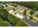 Aerial view of a property near a pond featuring home and a separate garage/workshop building at 3808 Mayfield Dr., Conway, SC 29526