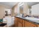 Bathroom featuring double sinks, cabinets, and a shower-tub combo with updated fixtures at 3808 Mayfield Dr., Conway, SC 29526