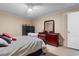 Bedroom with ceiling fan, dark safe, and cherry dresser at 3808 Mayfield Dr., Conway, SC 29526