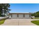 Detached metal garage with three bays and a large concrete parking pad at 3808 Mayfield Dr., Conway, SC 29526
