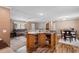 Open concept with kitchen island flowing into living and dining areas at 3808 Mayfield Dr., Conway, SC 29526