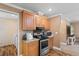 Well-lit kitchen featuring stainless steel appliances, light wood cabinetry and decorative wallpaper at 3808 Mayfield Dr., Conway, SC 29526