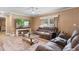 Inviting living room featuring a ceiling fan, a comfortable sofa, and a flat-screen TV at 3808 Mayfield Dr., Conway, SC 29526
