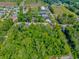 Aerial view of lush, wooded acreage near commercial area at 3827 El Duce Pl., Myrtle Beach, SC 29588