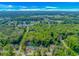 Aerial view of a neighborhood nestled amongst lush greenery and a large lake at 3827 El Duce Pl., Myrtle Beach, SC 29588