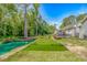 Backyard with a lush pond, manicured lawn, and cozy deck offers a relaxing retreat at 3827 El Duce Pl., Myrtle Beach, SC 29588