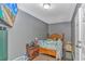 Cozy bedroom with a wooden bed frame and an on the wall TV at 3827 El Duce Pl., Myrtle Beach, SC 29588