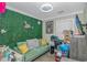 Cozy room with green couch, desk, and unique decor at 3827 El Duce Pl., Myrtle Beach, SC 29588