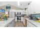 Modern kitchen features an island, granite countertops, and stainless steel appliances at 3827 El Duce Pl., Myrtle Beach, SC 29588