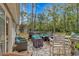 Inviting backyard deck area features an outdoor kitchen, dining, and lounge areas at 3827 El Duce Pl., Myrtle Beach, SC 29588