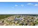 Aerial view showcasing 388 Hillsborough Drive within a neighborhood, near a pond and wooded area at 388 Hillsborough Dr., Conway, SC 29526