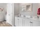 Clean bathroom with white cabinetry, a decorative mirror, and a spacious vanity area at 388 Hillsborough Dr., Conway, SC 29526