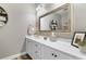 Well-lit bathroom featuring white cabinets, a large mirror, and stylish decor at 388 Hillsborough Dr., Conway, SC 29526
