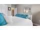 Comfortable bedroom with a queen bed and blue accents with access to an ensuite at 388 Hillsborough Dr., Conway, SC 29526