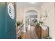 Inviting entryway with wood floors, decorative furniture, and a view into the home at 388 Hillsborough Dr., Conway, SC 29526