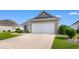 Single story home featuring a two car garage and manicured front yard with landscaping at 388 Hillsborough Dr., Conway, SC 29526