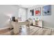 Bright office space with light wood floors, a white desk, and decorative movie posters at 388 Hillsborough Dr., Conway, SC 29526