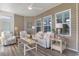 Cozy sunroom with comfortable furniture, bright windows, and decorative accents at 388 Hillsborough Dr., Conway, SC 29526
