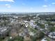 Aerial view of a residential area with marsh in background and house with a gray roof and a marker on it at 390 Boundary Ave., Murrells Inlet, SC 29576