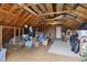 Unfinished attic space with exposed wood beams and rafters, ideal for customization and additional storage at 390 Boundary Ave., Murrells Inlet, SC 29576