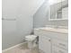 Bathroom with vanity, ample storage, tiled floor, updated fixture, and a shower at 390 Boundary Ave., Murrells Inlet, SC 29576