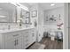 Bright bathroom featuring double sinks, plenty of counter space and a toilet at 390 Boundary Ave., Murrells Inlet, SC 29576