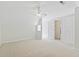 Spacious bedroom with neutral carpet, natural light, ceiling fan, and convenient closet access at 390 Boundary Ave., Murrells Inlet, SC 29576