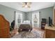 Bright bedroom with hardwood floors, a ceiling fan, and two windows at 390 Boundary Ave., Murrells Inlet, SC 29576
